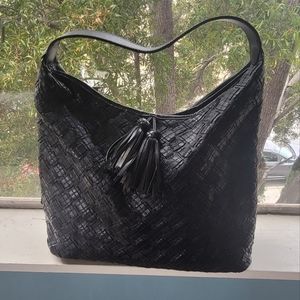 Black leather purse with shoulder strap